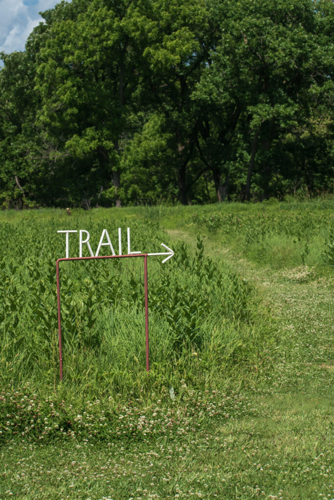 tallgrass-prairie-preserve-pawhuska The hiking trail entrance shows the way to the trails, a great thing to do in Pawhuska at the Tallgrass Prairie Preserve.