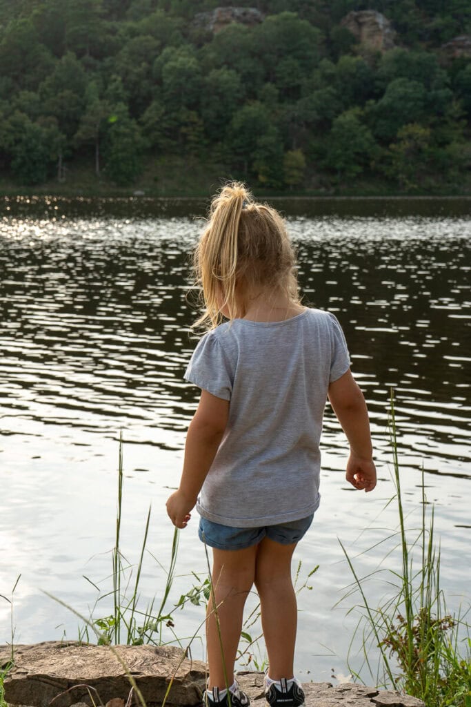 Girl overlooking Lake Carlton at Robbers Cave State Park
