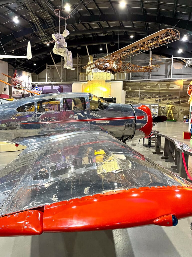 Tulsa Air and Space Museum main floor with planes hanging from the ceiling.