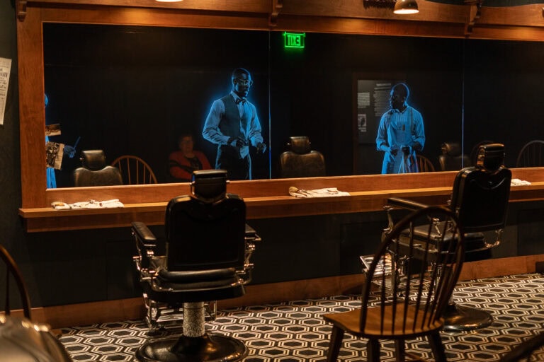 Barbershop at the Greenwood Rising History Center that has talking barbers on a screen.